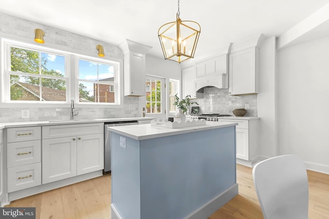 2402 E Randolph Ave, Alexandria, VA 22301 - kitchen with a sink, light countertops, tasteful backsplash, and white cabinetry