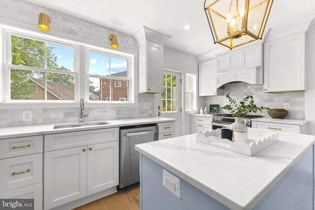 2402 E Randolph Ave, Alexandria, VA 22301 - kitchen featuring stainless steel appliances, a sink, backsplash, white cabinetry, and recessed lighting
