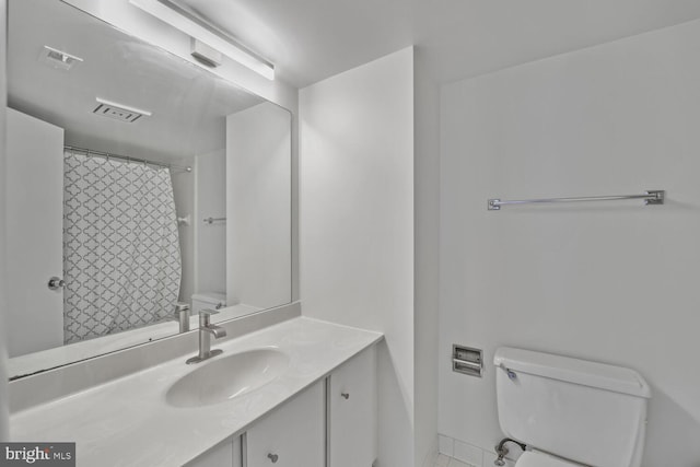 1140 23rd St NW Unit 903, Washington, DC 20037 - bathroom with toilet, vanity, and tile patterned flooring