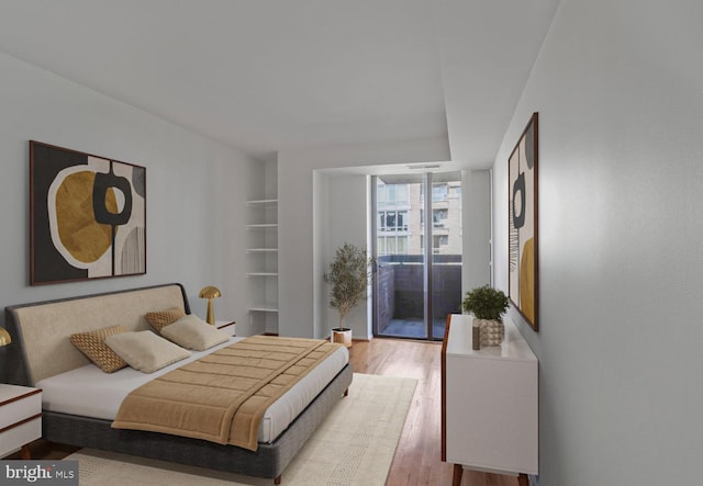 1140 23rd St NW Unit 903, Washington, DC 20037 - bedroom with wood finished floors and access to outside