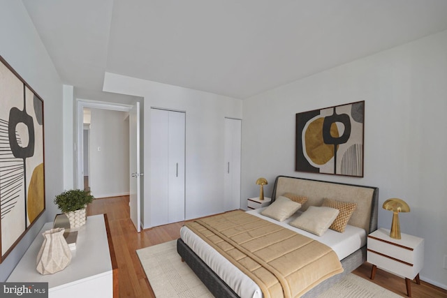 1140 23rd St NW Unit 903, Washington, DC 20037 - bedroom with wood finished floors and baseboards