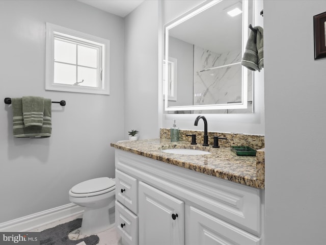 8211 Hocking Pl, Alexandria, VA 22309 - bathroom with vanity, toilet, a marble finish shower, and baseboards