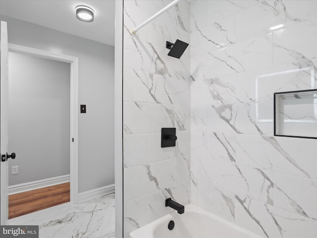 8211 Hocking Pl, Alexandria, VA 22309 - bathroom featuring shower / bathtub combination and baseboards