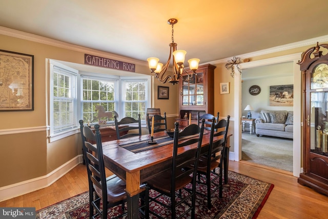 1864 Edge Hill Rd, Abington, PA 19001 - dining area featuring a chandelier, ornamental molding, light wood finished floors, and baseboards