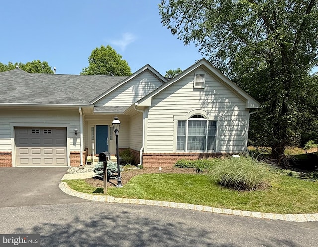 11 Birchwood Ct, Princeton, NJ 08540 - view of front of property with brick siding, an attached garage, driveway, and a front yard