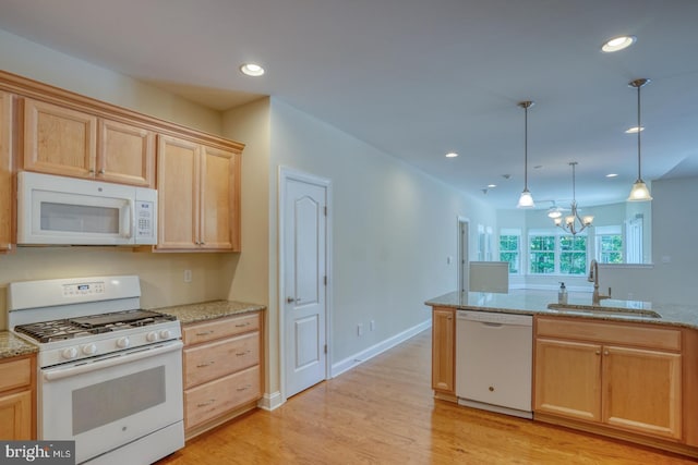 18208 Emerson Way, Georgetown, DE 19947 - kitchen with white appliances, light brown cabinets, light wood-type flooring, recessed lighting, and a chandelier