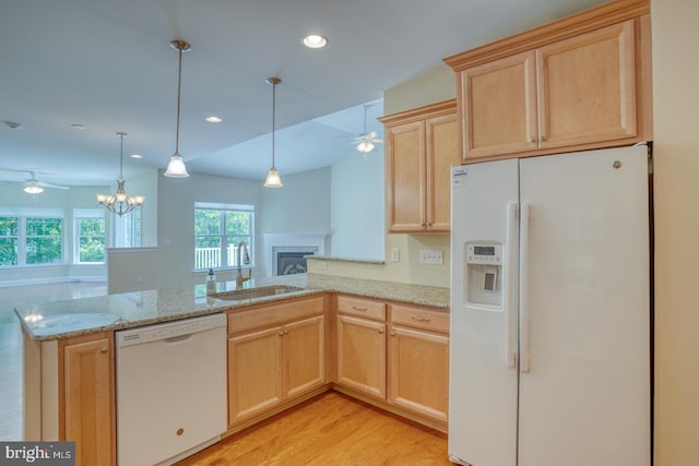 18208 Emerson Way, Georgetown, DE 19947 - kitchen featuring white appliances, light brown cabinetry, a ceiling fan, open floor plan, and a fireplace