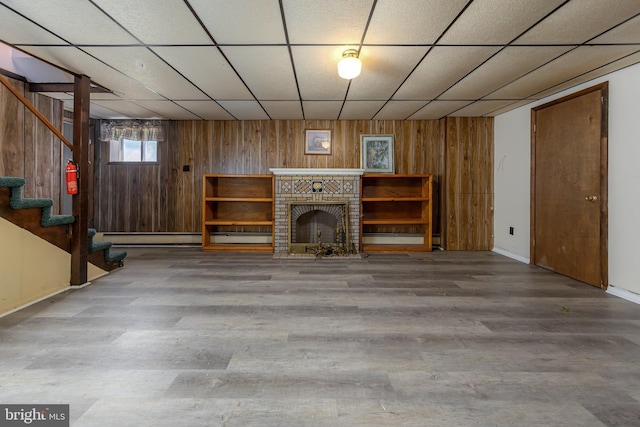 222 Nicholson Rd, Mount Ephraim, NJ 08059 - unfurnished living room featuring wood walls, a paneled ceiling, stairway, wood finished floors, and baseboards