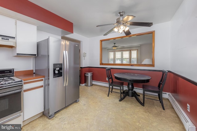 222 Nicholson Rd, Mount Ephraim, NJ 08059 - kitchen featuring appliances with stainless steel finishes, light floors, exhaust hood, a baseboard heating unit, and wainscoting