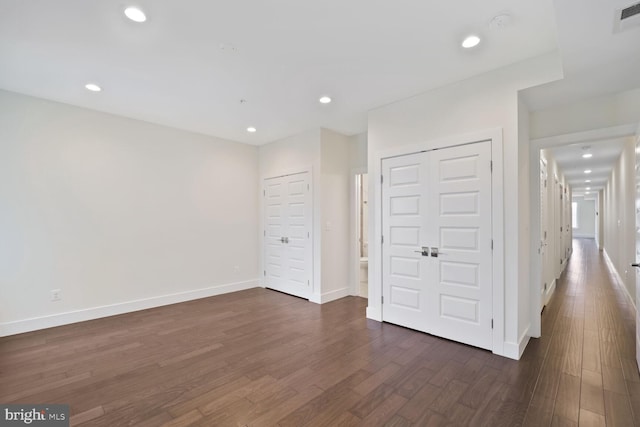 525 Kennedy St NW Unit 4, Washington, DC 20011 - unfurnished bedroom with dark wood-style floors, baseboards, and recessed lighting
