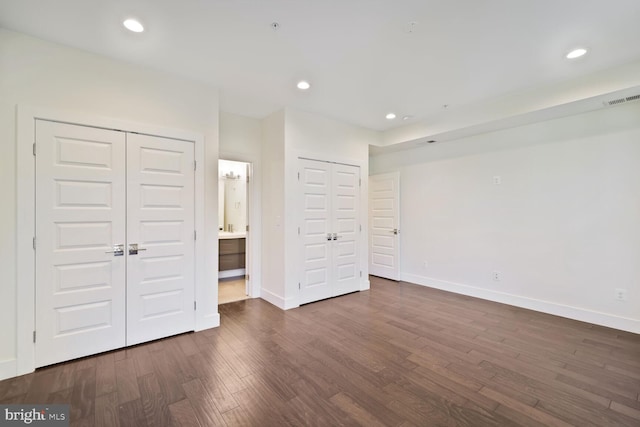 525 Kennedy St NW Unit 4, Washington, DC 20011 - unfurnished bedroom with dark wood-type flooring, baseboards, and recessed lighting