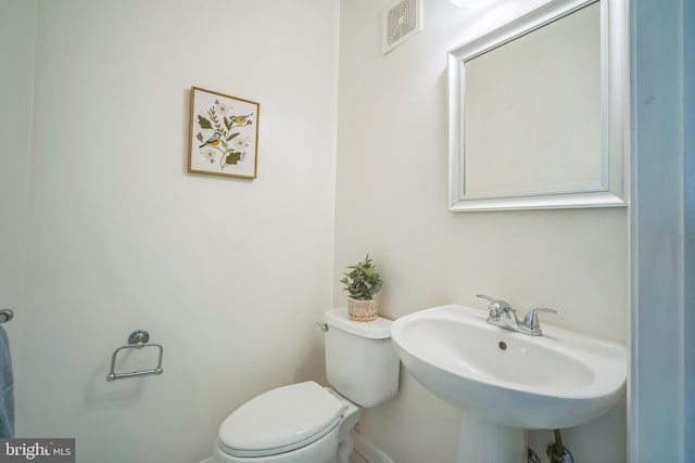 5932 Kimberly Anne Way, Alexandria, VA 22310 - half bath with toilet, a sink, and baseboards