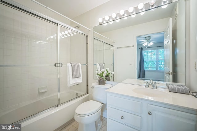 5932 Kimberly Anne Way, Alexandria, VA 22310 - bathroom with shower / bath combination with glass door, vanity, toilet, tile patterned floors, and ceiling fan