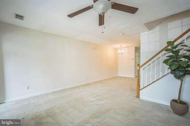 5932 Kimberly Anne Way, Alexandria, VA 22310 - spare room with light carpet, stairs, baseboards, a chandelier, and a ceiling fan