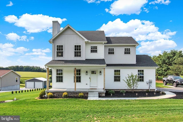 2536 Stoverstown Rd, Spring Grove, PA 17362 - modern farmhouse style home with covered porch, a front yard, a chimney, and a shingled roof