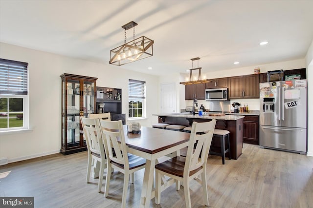 2536 Stoverstown Rd, Spring Grove, PA 17362 - dining area with light wood finished floors, recessed lighting, a chandelier, and baseboards