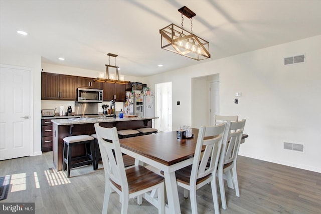2536 Stoverstown Rd, Spring Grove, PA 17362 - dining space with light wood-style flooring, recessed lighting, a chandelier, and baseboards