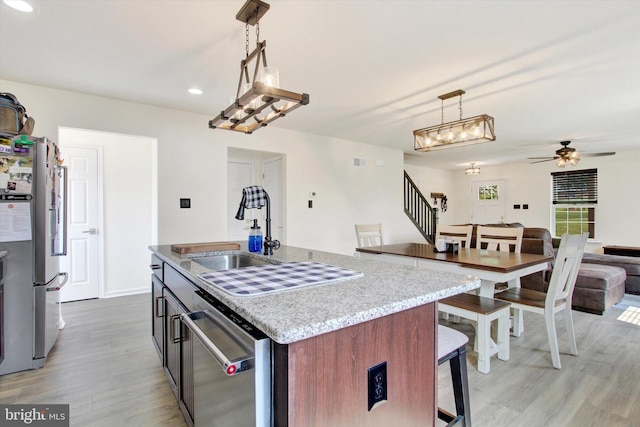 2536 Stoverstown Rd, Spring Grove, PA 17362 - kitchen with freestanding refrigerator, light wood-type flooring, dishwasher, open floor plan, and a ceiling fan