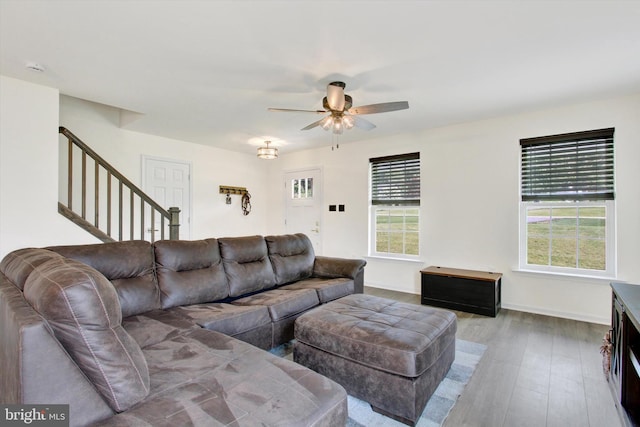 2536 Stoverstown Rd, Spring Grove, PA 17362 - living area featuring a ceiling fan, stairs, wood finished floors, and baseboards