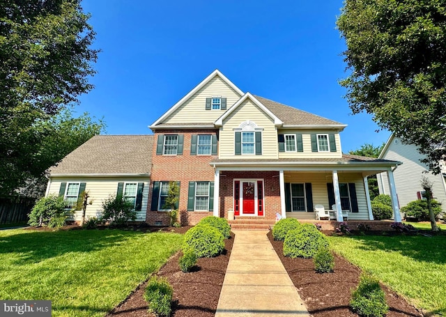 1009 S Washington St, Easton, MD 21601 - view of front of house featuring brick siding and a porch