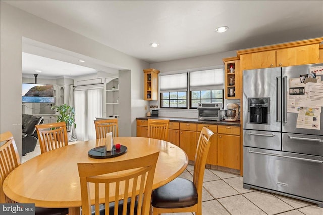 1609 Wills Pl, Vineland, NJ 08361 - kitchen with stainless steel refrigerator with ice dispenser, light tile patterned floors, glass insert cabinets, dark countertops, and recessed lighting