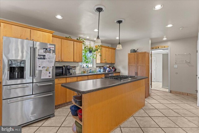 1609 Wills Pl, Vineland, NJ 08361 - kitchen with stainless steel appliances, light tile patterned floors, dark countertops, a kitchen island, and recessed lighting