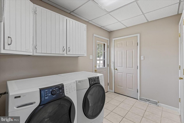 1609 Wills Pl, Vineland, NJ 08361 - laundry area featuring cabinet space, washing machine and clothes dryer, baseboards, and light tile patterned floors