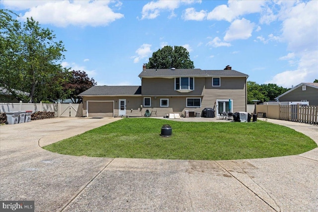 1609 Wills Pl, Vineland, NJ 08361 - rear view of property featuring a chimney, driveway, a gate, and an attached garage