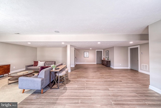 547 Webb Rd # Ad, Chadds Ford, PA 19317 - living area featuring baseboards, wood finished floors, a textured ceiling, and recessed lighting
