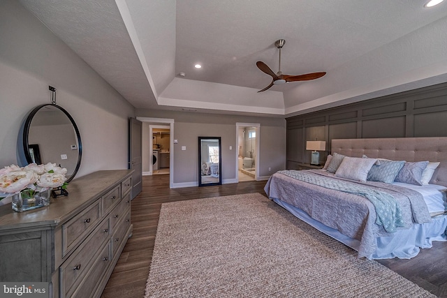 547 Webb Rd # Ad, Chadds Ford, PA 19317 - bedroom featuring dark wood-type flooring, a tray ceiling, recessed lighting, washer / clothes dryer, and baseboards
