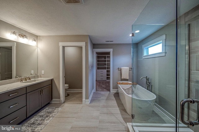 547 Webb Rd # Ad, Chadds Ford, PA 19317 - full bath with toilet, vanity, a freestanding bath, a walk in closet, and a stall shower