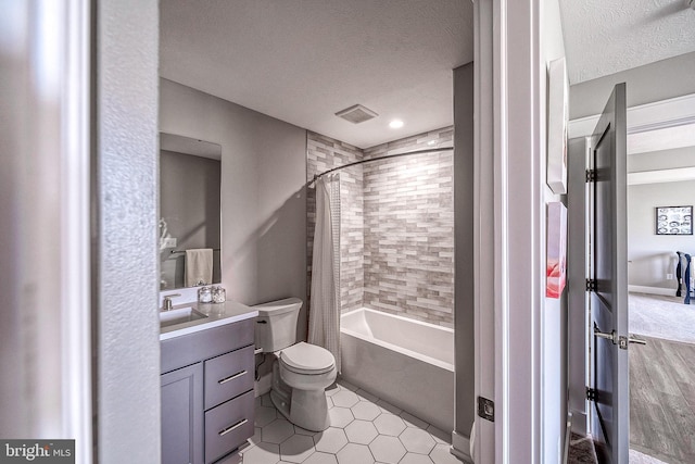 547 Webb Rd # Ad, Chadds Ford, PA 19317 - full bathroom with vanity, a textured ceiling, shower / bath combo with shower curtain, toilet, and tile patterned flooring
