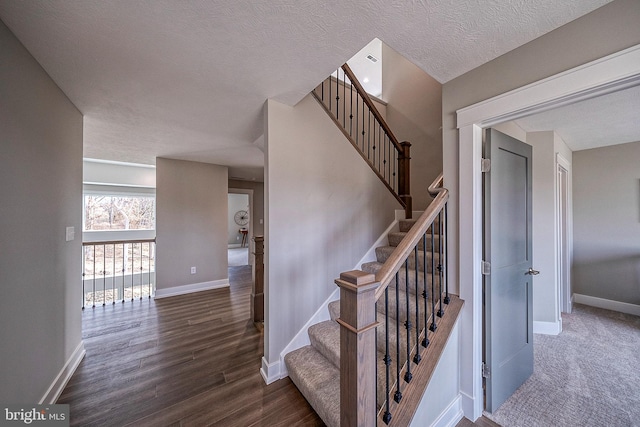 547 Webb Rd # Ad, Chadds Ford, PA 19317 - stairway with baseboards, wood finished floors, and a textured ceiling