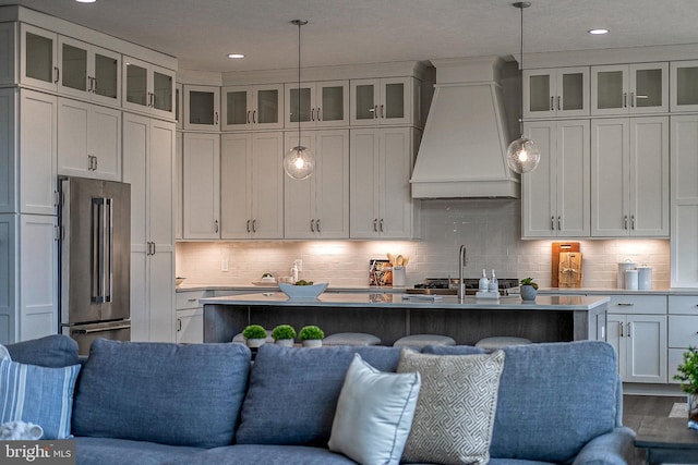 547 Webb Rd # Ad, Chadds Ford, PA 19317 - kitchen featuring custom exhaust hood, high quality fridge, open floor plan, an island with sink, and recessed lighting
