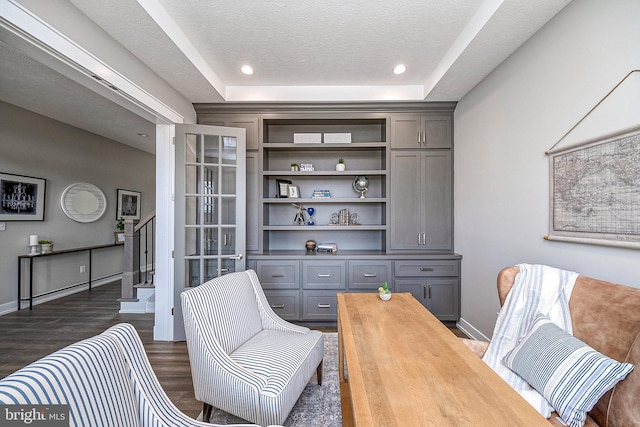 547 Webb Rd # Ad, Chadds Ford, PA 19317 - living area with dark wood-style flooring, stairway, a raised ceiling, baseboards, and a textured ceiling