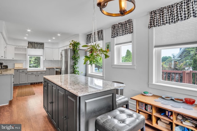 1749 Carrolls Tract Rd, Orrtanna, PA 17353 - kitchen featuring plenty of natural light, freestanding refrigerator, open shelves, tasteful backsplash, and recessed lighting