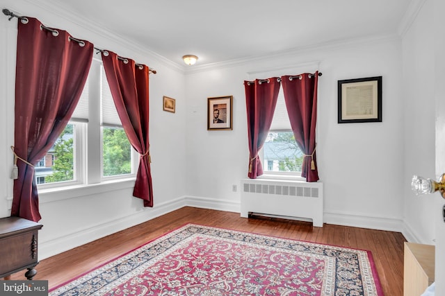 1749 Carrolls Tract Rd, Orrtanna, PA 17353 - empty room featuring radiator, wood finished floors, crown molding, and baseboards
