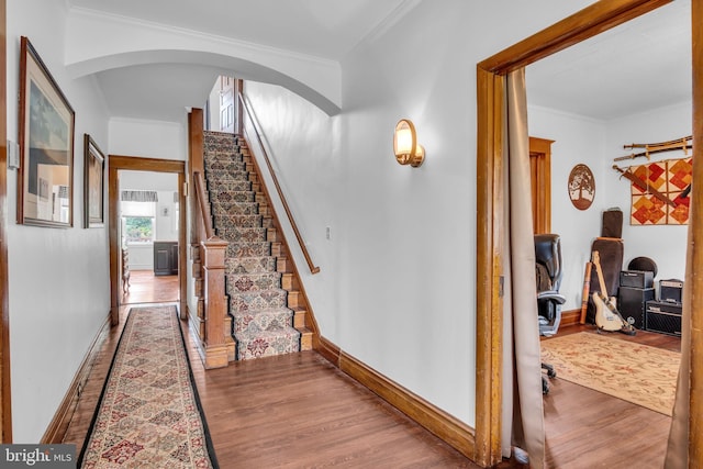 1749 Carrolls Tract Rd, Orrtanna, PA 17353 - stairway with wood finished floors, crown molding, arched walkways, and baseboards