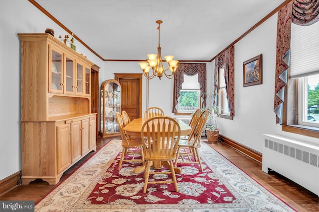 1749 Carrolls Tract Rd, Orrtanna, PA 17353 - dining space featuring radiator, a chandelier, crown molding, wood finished floors, and baseboards