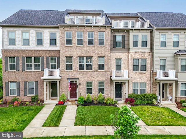 2069 Alder Ln, Dumfries, VA 22026 - multi unit property featuring a front lawn and brick siding
