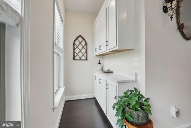2069 Alder Ln, Dumfries, VA 22026 - bar area with baseboards and dark wood-type flooring