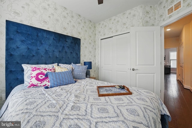 2069 Alder Ln, Dumfries, VA 22026 - bedroom featuring wallpapered walls, wood-type flooring, and a closet