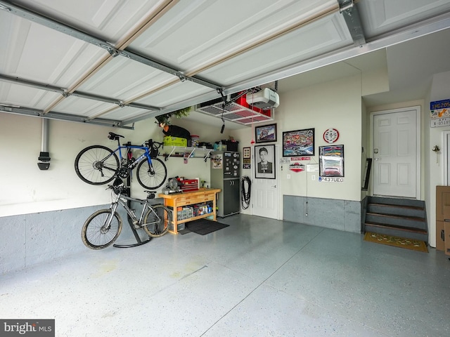 2069 Alder Ln, Dumfries, VA 22026 - garage featuring a garage door opener