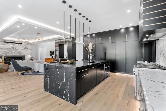 1519 Spring Vale Ave, Mclean, VA 22101 - kitchen with a sink, dark cabinets, light wood-style floors, black oven, and recessed lighting
