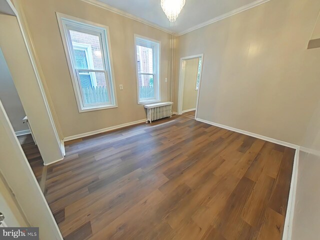 4019 N Marshall St, Philadelphia, PA 19140 - unfurnished room featuring radiator heating unit, ornamental molding, wood finished floors, and a chandelier