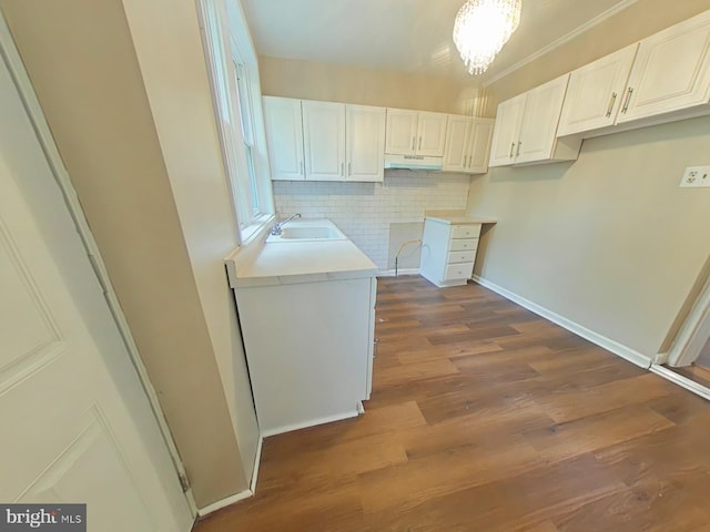 4019 N Marshall St, Philadelphia, PA 19140 - washroom featuring dark wood-type flooring and a chandelier