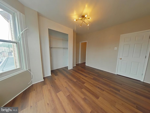 4019 N Marshall St, Philadelphia, PA 19140 - unfurnished bedroom with wood finished floors, a closet, and a chandelier