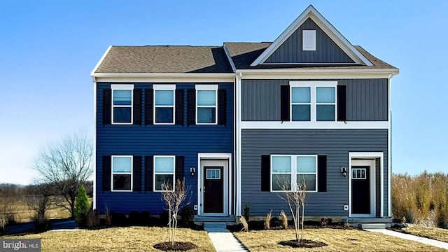 100 Red Haven Way, Dover, DE 19904 - townhome / multi-family property with entry steps, board and batten siding, and a front yard