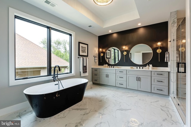 6800 Old Chesterbrook Rd, Mclean, VA 22101 - full bathroom with baseboards, double vanity, marble finish flooring, a freestanding bath, and a shower stall
