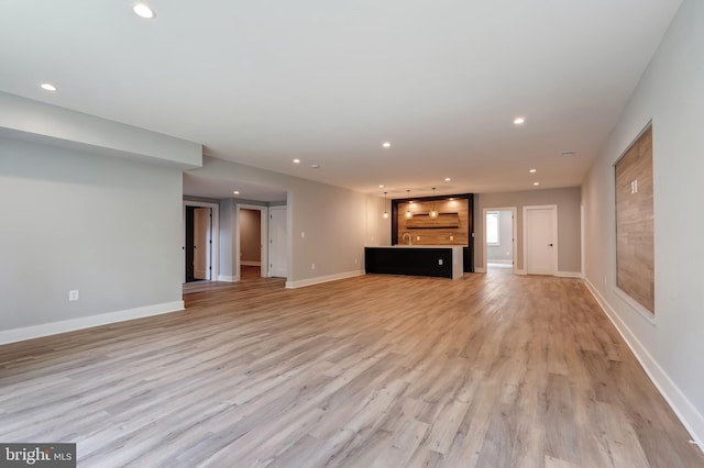 6800 Old Chesterbrook Rd, Mclean, VA 22101 - unfurnished living room with light wood finished floors, recessed lighting, and baseboards